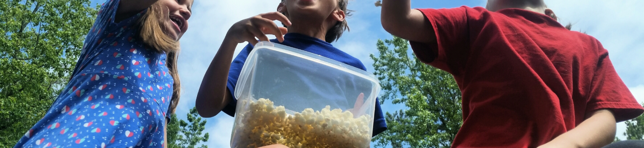 Children playing with popcorn
